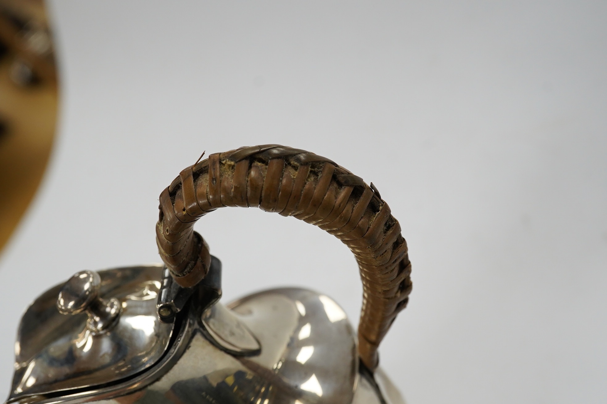 A George II small silver sauceboat, Gwillim & Castle, London, 1744, length 13.6cm, together with a George III silver hot water jug, London, 1791, gross 9.6oz. Condition - poor